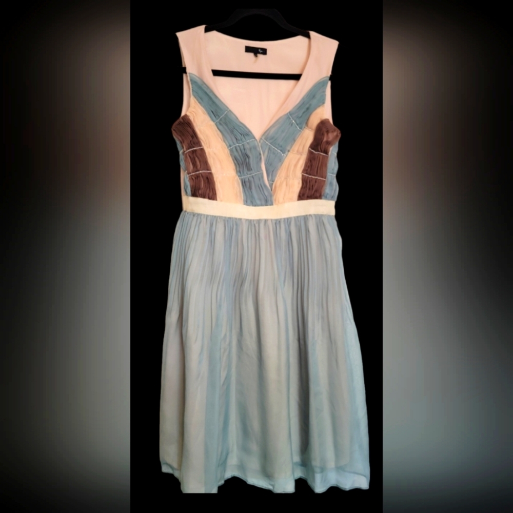 Small sleveless mini dress with sheer lace